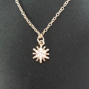 gold sun necklace with inset stones